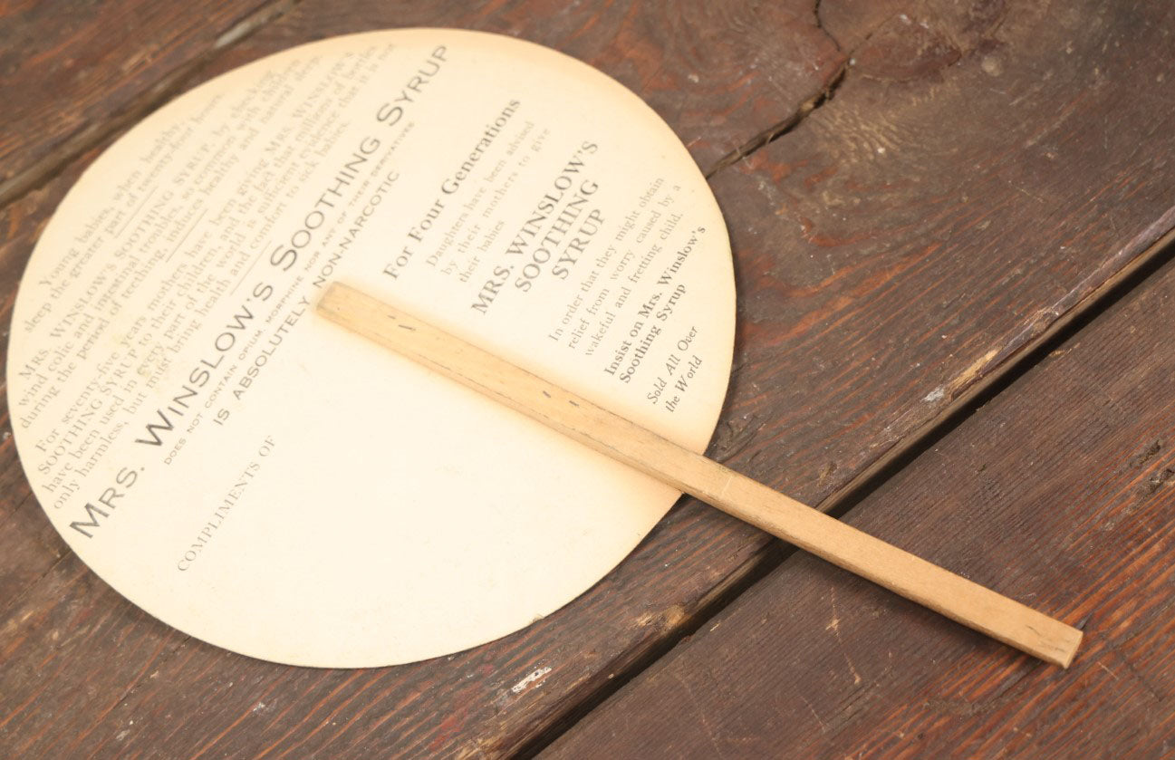 Lot 097 - Antique Paper Advertising Fan Compliments Of Mrs. Winslow's Soothing Syrup, With Mother And Baby On Front, For Children Teething