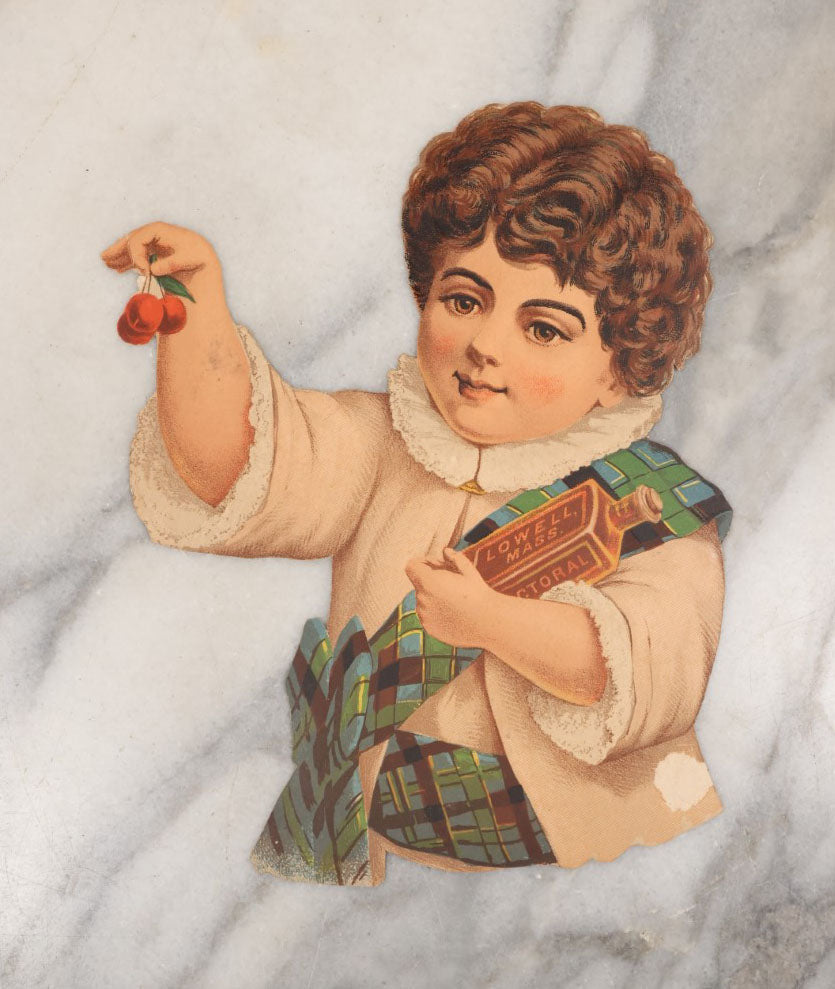Lot 098 - Antique Die Cut Scrap Of A Little Child Holding Cherries And An Amber Bottle Labeled Lowell, Mass