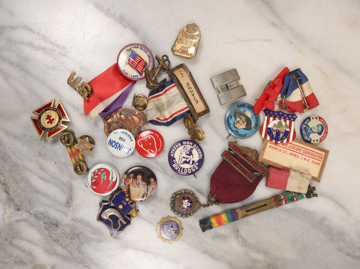 Lot 139 - Junk Drawer Grouping, 20+ Pins And Pinback Buttons, Ribbons And More, Including Athens High School Bulldogs, Gene Autry, Johnson For President, And Others