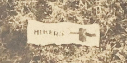 Lot 125 - Early Selfie, Antique Boarded Photograph Of A Group Of Men, Hikers, Forming An H On The Ground, With Hiker Flag On Grass, Note Man Left Center Pulling String To Operate The Shutter, Take Photo