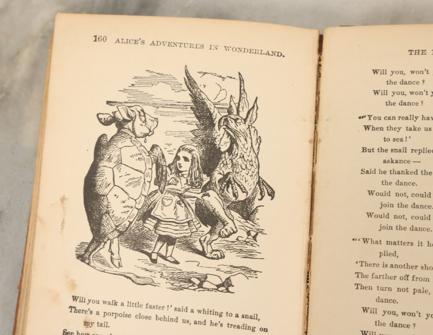 Lot 140 - "Alice's Adventures In Wonderland" Antique Book By Lewis Carroll With Burnt Red Art Nouveau Cover Design And Illustrations Throughout, Note Binding Wear, Circa Late 19th Century