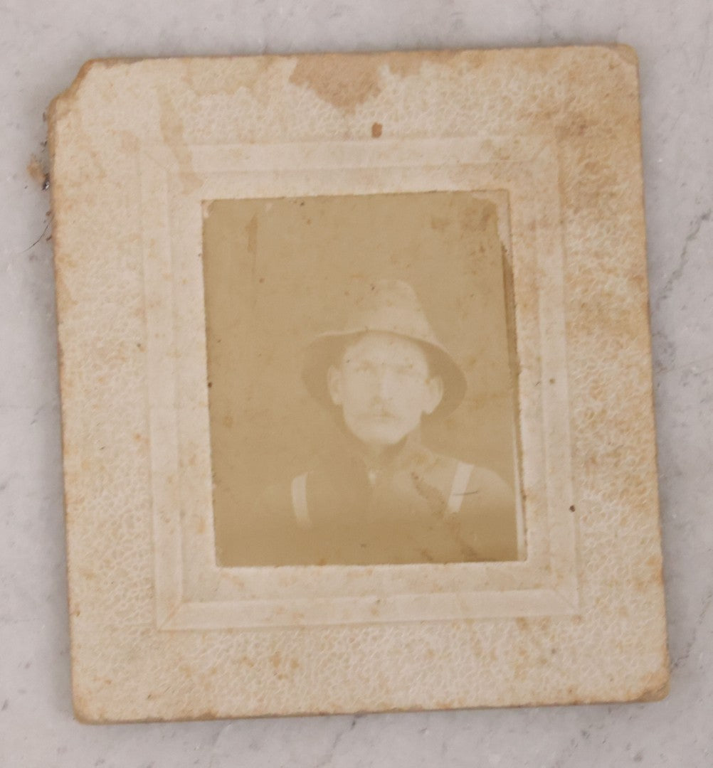 Lot 166 - Grouping Of Four Antique Occupational Photographs Including Miniature Boarded Photo Of Possible Firefighter, R.P.P.C. Of Men With Horse And Carriage, R.P.P.C. Of Train Conductor, And Poor Condition R.P.P.C. Of Sawmill