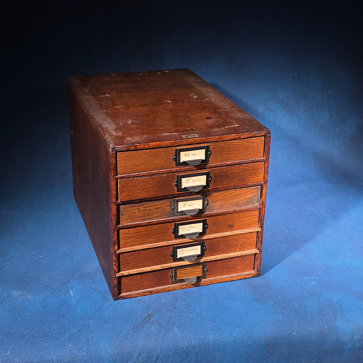 Vintage Oak Five-Drawer Cabinet with Clock Repair Paper Dial Faces including Ansonia, Sessions, and Ingraham