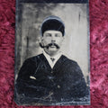 Lot 097 - Tintype Of Man In Russian Hat Smoking Pipe