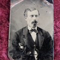 Lot 098 - Tintype Of Man In Bowtie Smoking Pipe