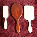Lot 064 - Three Piece Dresser Grouping Including Mirror And Brush Manufactured In Florence, Northampton, Massachusetts, And Wooden Mirror