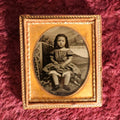 Lot 069 - Antique 1/6th Plate Ambrotype Photograph Of Young Girl In Polka Dot Dress, Outdoor Studio Scene, In Half Leatherette Case