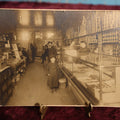 Lot 137 - Small Boarded Photo - General Store Interior Occupational Photo, Many Cans, Ads, Young Boy At Center, Men Around Wood Stove