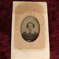 Lot 109 - Antique Ambrotype Photograph of Young Woman Wearing White Collar, Uncased, With Paper Frame And Fabric Textile Tape Lack Backing, 1/9th Plate
