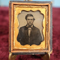 Lot 110 - Antique Ambrotype Photograph of Young Man In Bowtie, Swoopy Hair, In Half Leatherette Union Case, 1/9th Plate