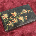 Lot 118 - Tiny Black Laquered Tin With Hand Painted Flowers