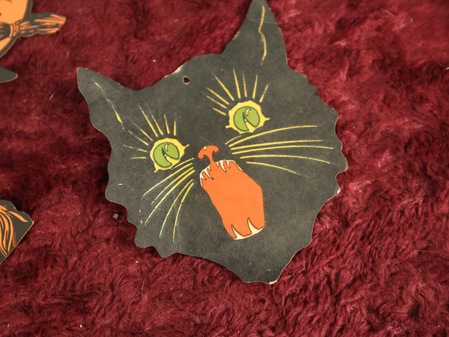 Lot 025 - Grouping Of Eight Plus Vintage Halloween Paper Cutouts Including Witches, Pumpkin, And Cat Face, With Extra Scraps