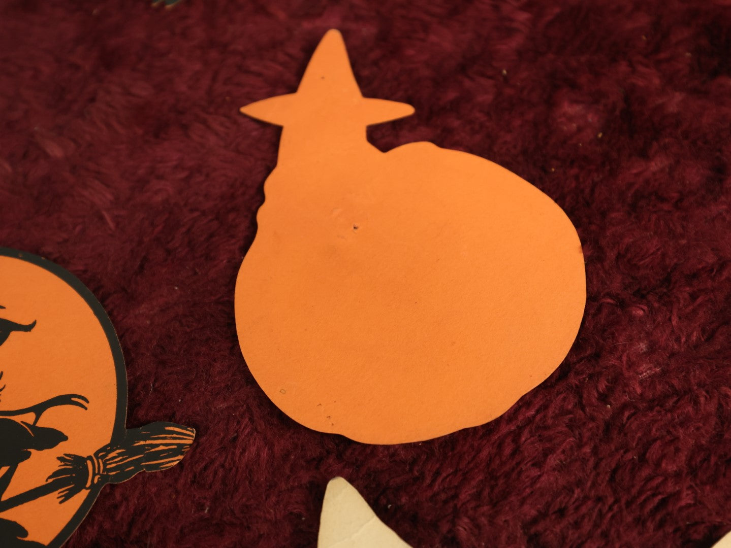 Lot 025 - Grouping Of Eight Plus Vintage Halloween Paper Cutouts Including Witches, Pumpkin, And Cat Face, With Extra Scraps