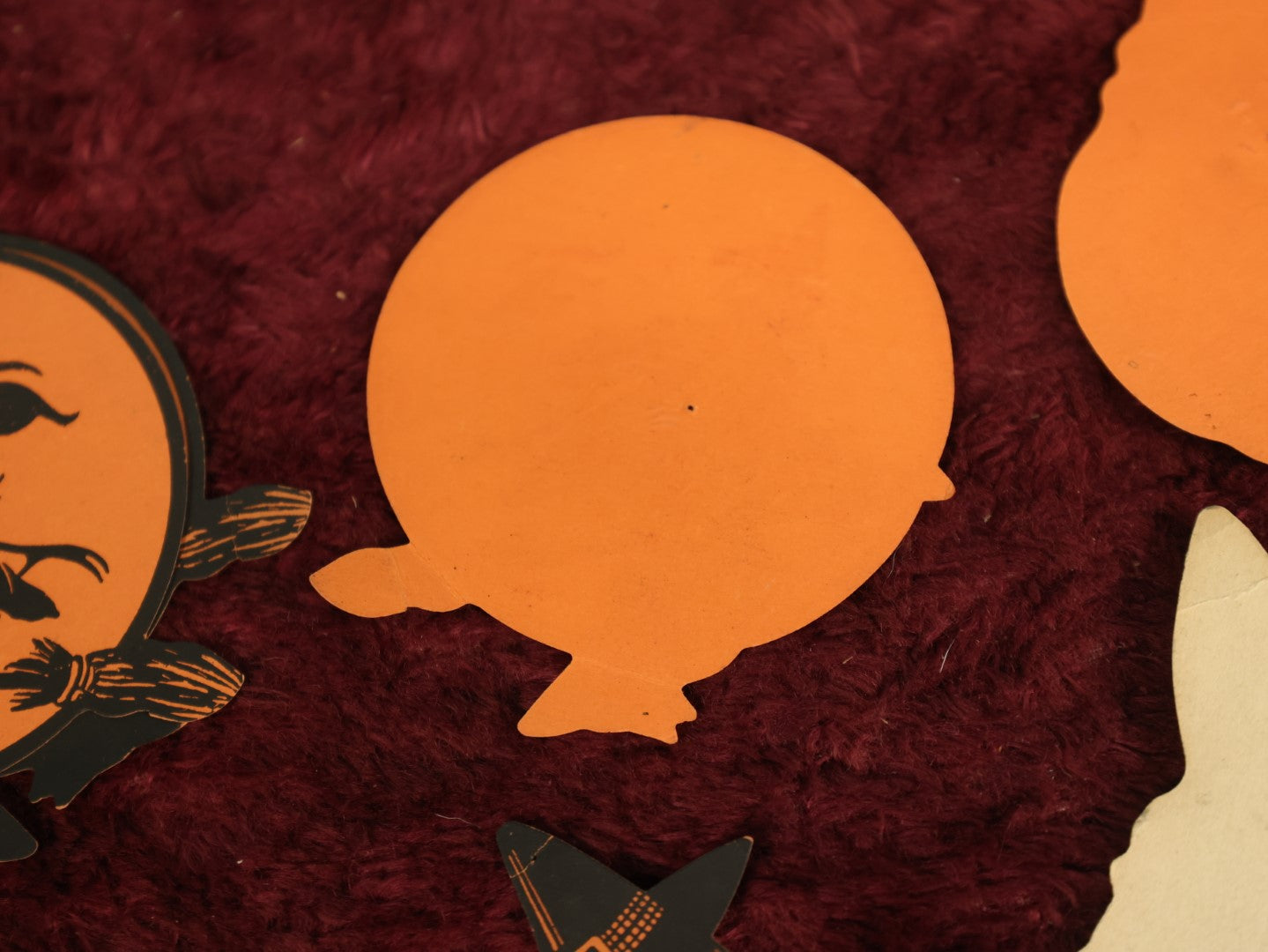 Lot 025 - Grouping Of Eight Plus Vintage Halloween Paper Cutouts Including Witches, Pumpkin, And Cat Face, With Extra Scraps