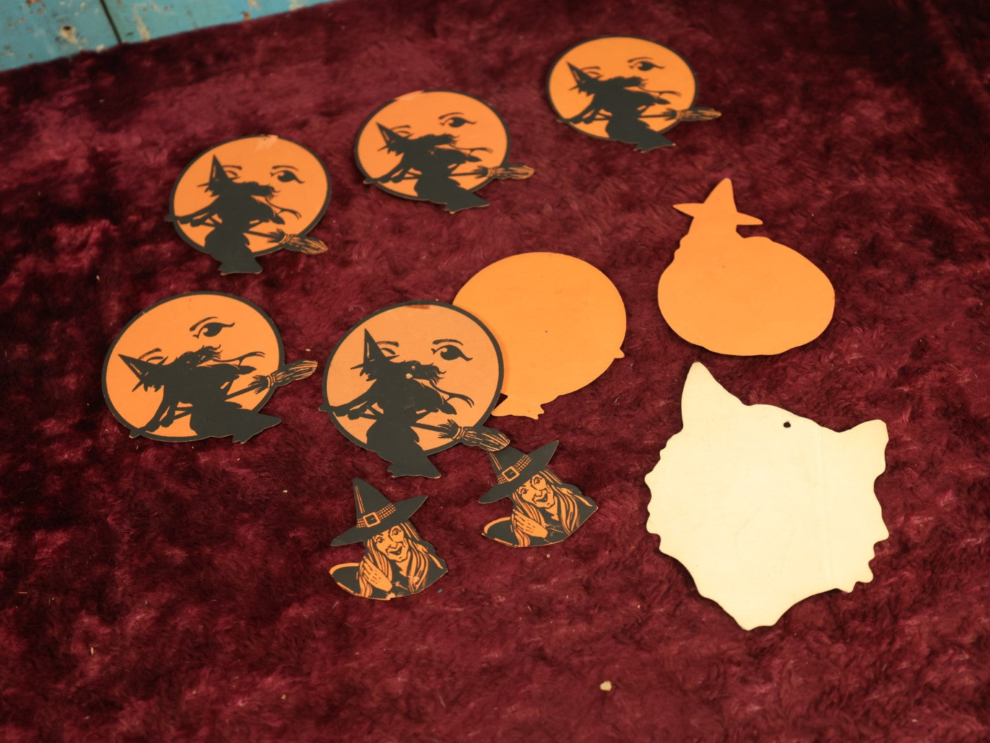 Lot 025 - Grouping Of Eight Plus Vintage Halloween Paper Cutouts Including Witches, Pumpkin, And Cat Face, With Extra Scraps