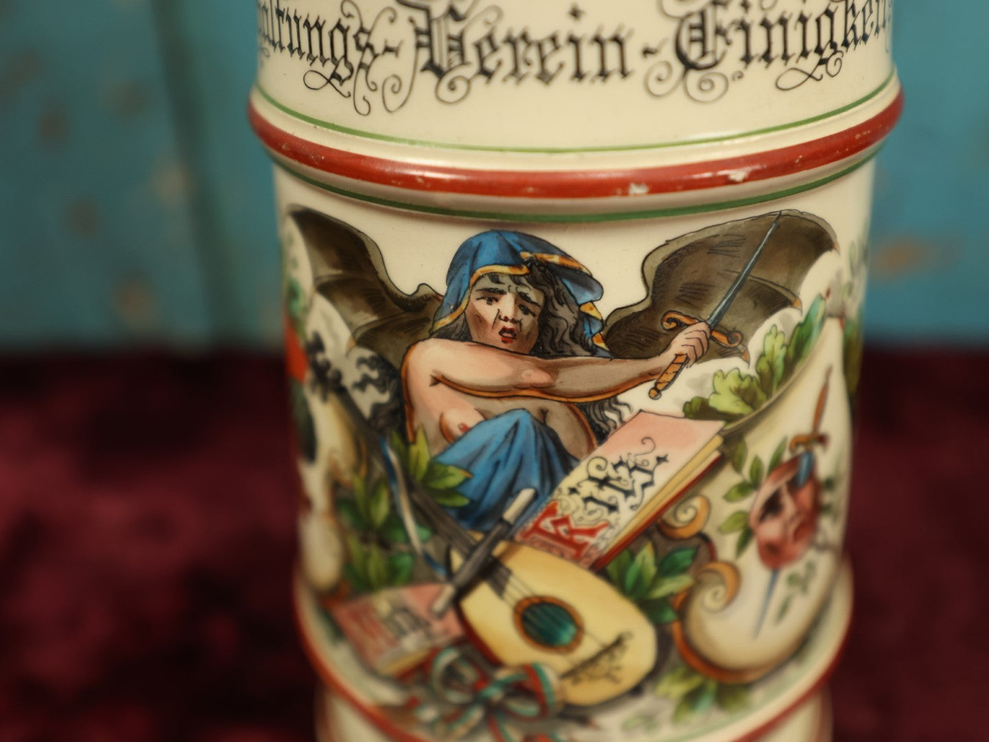 Lot 027 - Antique 1905 German Stein Having To Do With A Social Club, Featuring Winged Bat-Like Woman, Face Impaled Through Eye Ball, Augsburg Coat Of Arms, Signed Jos. (Joseph) Weber, Augsburg, With Markings