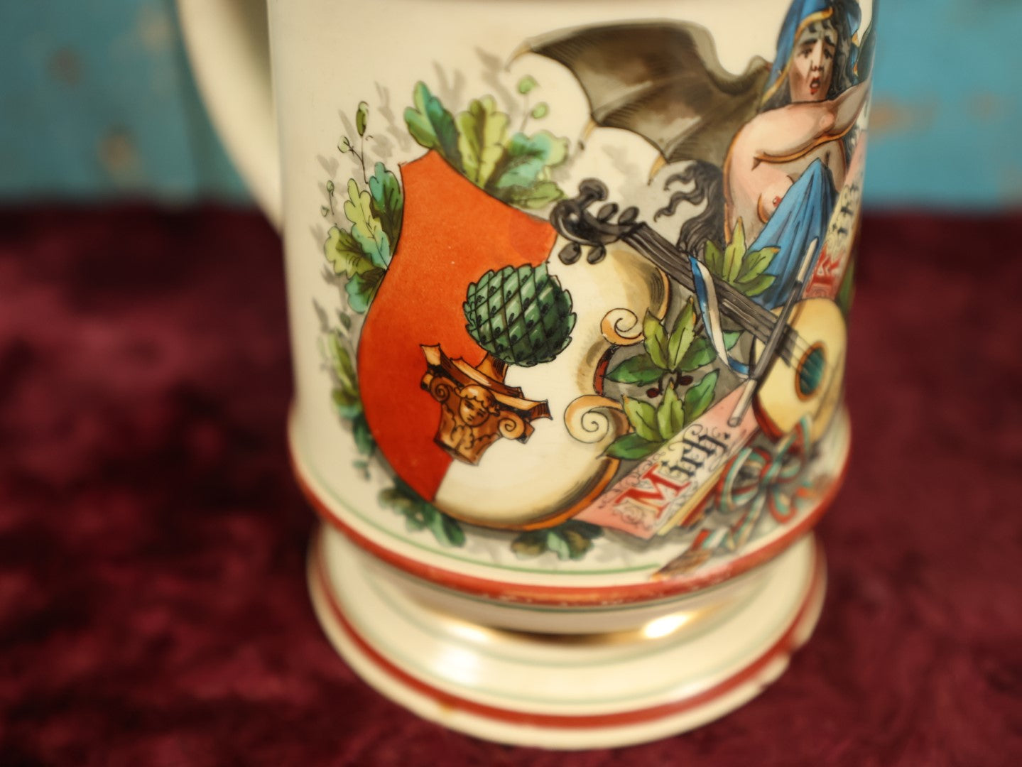 Lot 027 - Antique 1905 German Stein Having To Do With A Social Club, Featuring Winged Bat-Like Woman, Face Impaled Through Eye Ball, Augsburg Coat Of Arms, Signed Jos. (Joseph) Weber, Augsburg, With Markings