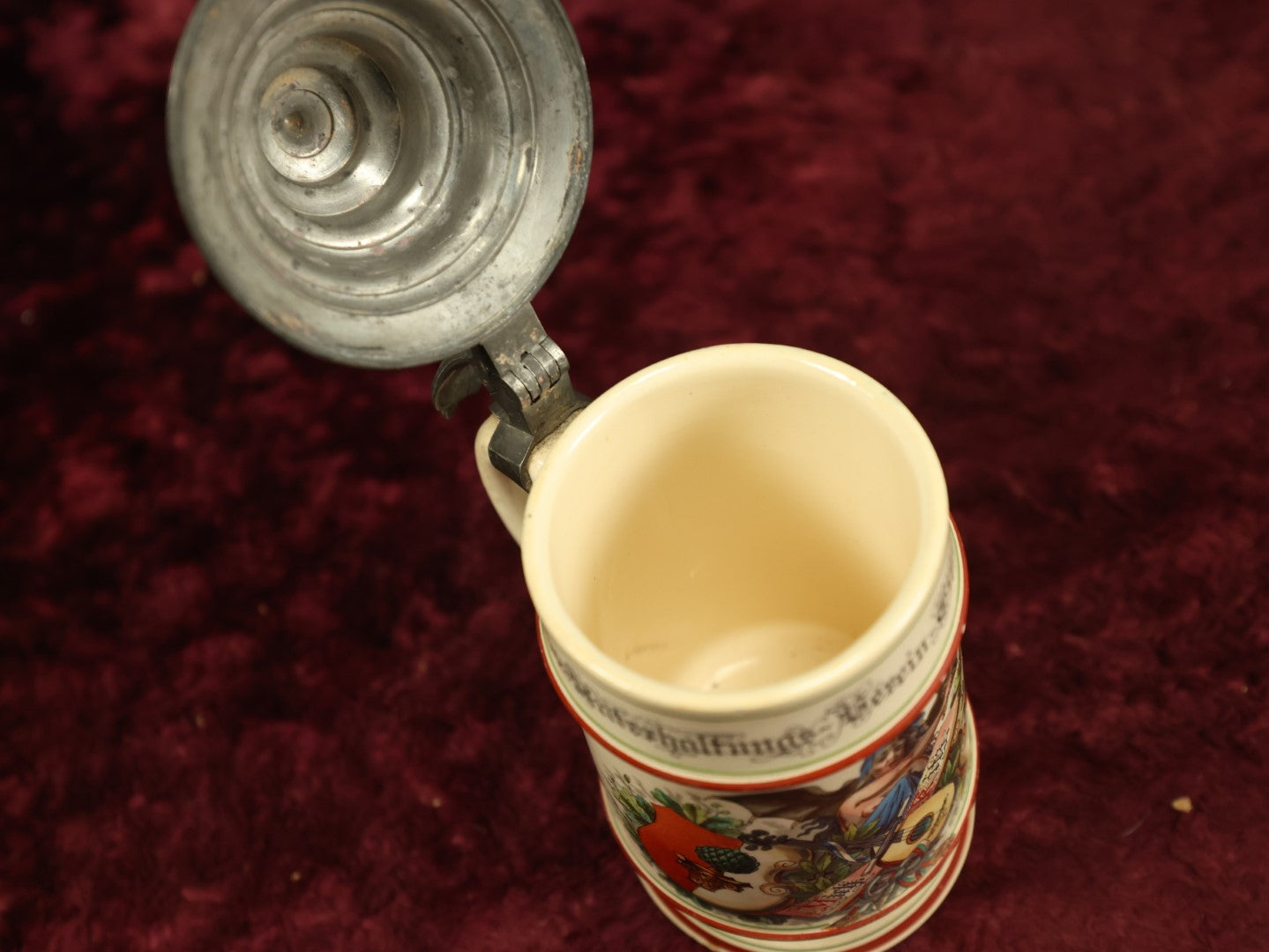 Lot 027 - Antique 1905 German Stein Having To Do With A Social Club, Featuring Winged Bat-Like Woman, Face Impaled Through Eye Ball, Augsburg Coat Of Arms, Signed Jos. (Joseph) Weber, Augsburg, With Markings