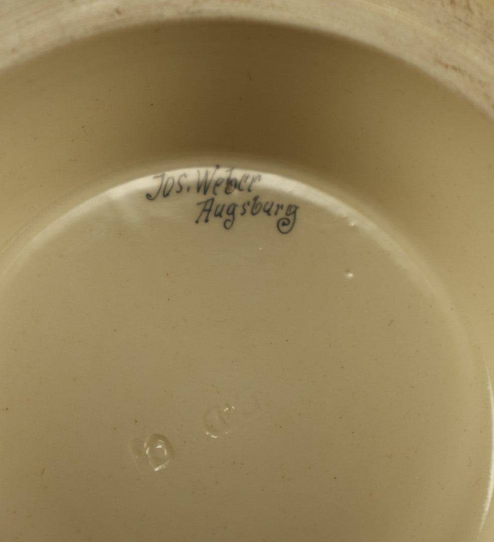 Lot 027 - Antique 1905 German Stein Having To Do With A Social Club, Featuring Winged Bat-Like Woman, Face Impaled Through Eye Ball, Augsburg Coat Of Arms, Signed Jos. (Joseph) Weber, Augsburg, With Markings