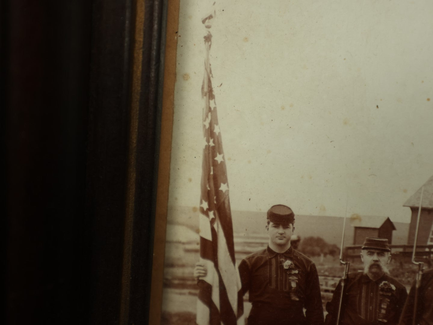 Lot 054 - Antique Framed Boarded Photo Of Soldiers With Various Ribbons, Flag, Etc., Possibly Nebraska Volunteers Or Militia, As Written On Back Of Frame