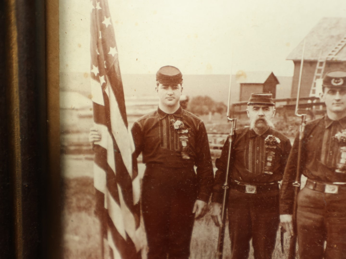 Lot 054 - Antique Framed Boarded Photo Of Soldiers With Various Ribbons, Flag, Etc., Possibly Nebraska Volunteers Or Militia, As Written On Back Of Frame