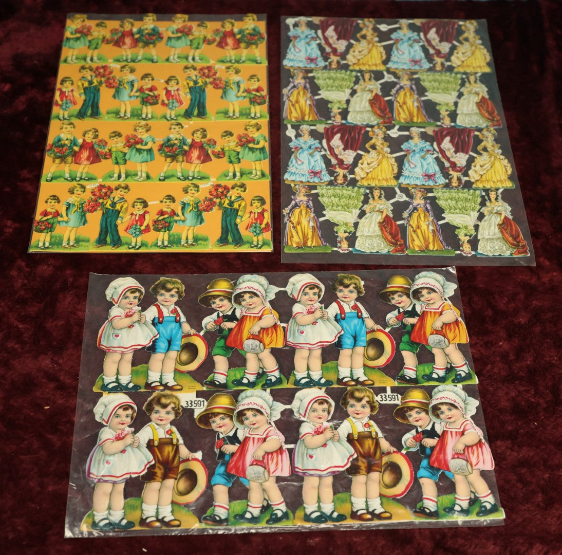 Lot 060 - Grouping Of Three Uncut Die Cut Scrapbooking Paper Sheets, Two Depicting Children, One Of Elegantly Dressed Women, Printed In Germany