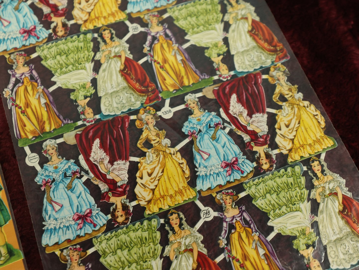 Lot 060 - Grouping Of Three Uncut Die Cut Scrapbooking Paper Sheets, Two Depicting Children, One Of Elegantly Dressed Women, Printed In Germany