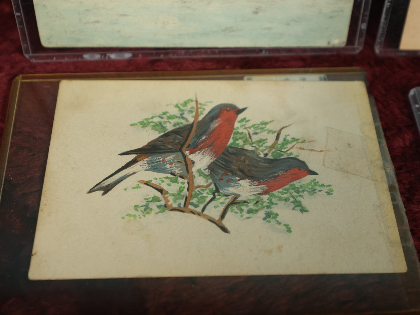 Lot 073 - Grouping Of Four Hand Painted Postcards And Scraps, North Wilmot Church, 1935 Signed E.M.A., Lake Pennesseewassee, Norway, Maine, Red Robins, And Happy New Year Winter Scene  