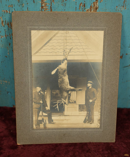 Lot 105 - Single Boarded Photo Of Deer Buck Strung Up, Hunters Look On Holding Rifles