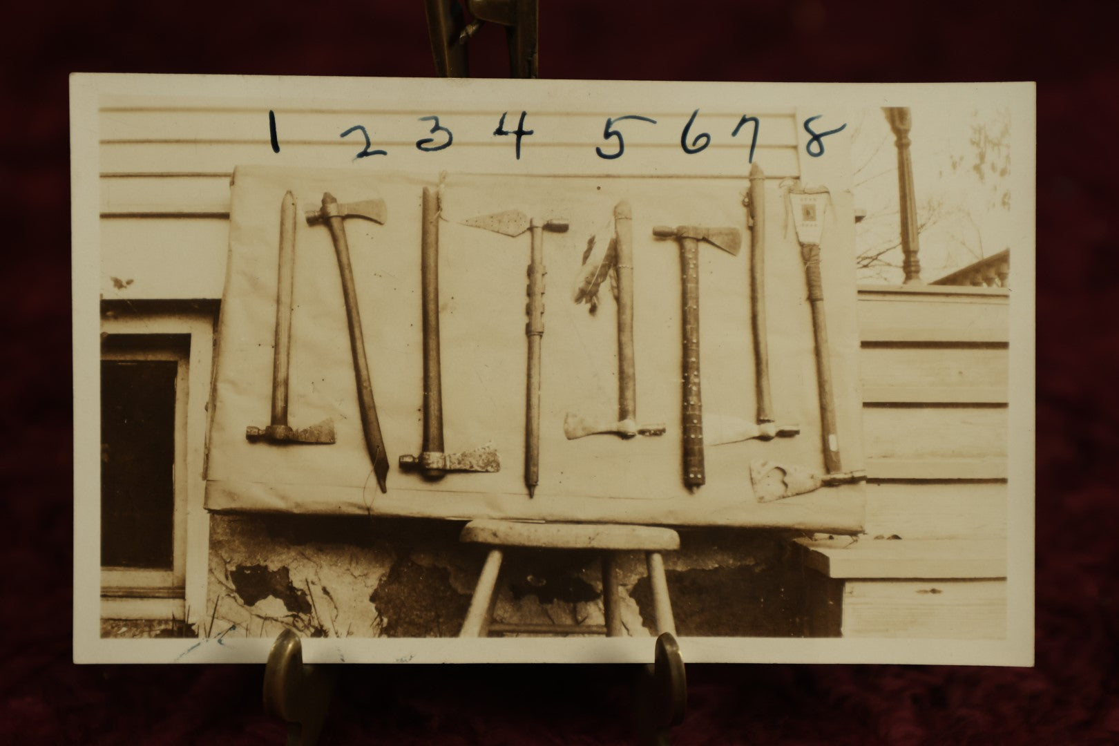 Lot 112 - Single Snapshot Photo, Eight Tomahawk Axes, Paper Label On Back, N.E. Carter, Indian Relics, Old Arms, Antiques, And Curios, Elkhorn, Wisconsin