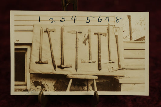 Lot 112 - Single Snapshot Photo, Eight Tomahawk Axes, Paper Label On Back, N.E. Carter, Indian Relics, Old Arms, Antiques, And Curios, Elkhorn, Wisconsin