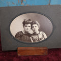 Lot 120 - Simple Small Boarded Photo Of Two Young Women Wearing Dresses And Bows