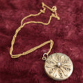 Lot 019 - Vintage Brass Locket On Gold Filled Chain Containing A Photo Of A Man And A Lock Of Blonde Hair