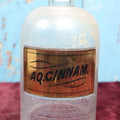 Lot 038 - Antique Cinnamon Water Apothecary Bottle With Glass "Aq. Cinnam." Label, Approximately 12"