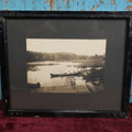 Lot 050 - Unusual Antique Framed Photo Of Two Women In A Canoe With A Skull And Crossbones / Jolly Roger Pillow, Boat Named Hiawatha, American Flag In Frame