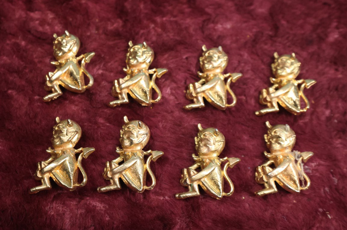 Lot 083 - Eight Vintage Brass Little Devil 