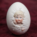 Lot 088 - Antique Bisque Porcelain "Birthing Egg," Baby Breaking Out Of Egg, Butt On Back, No Hole In Bottom, Likely German