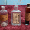 Lot 089 - Grouping Of Three Antique Hand Blown Glass Pontiled Bottles With Apothecary Labels Including Chloroform, Laudanum, And Gentian, Labels From Vermont And New York