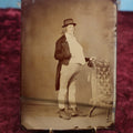 Lot 107 - Antique Tintype Photograph Of Young Man Dressed In Portly Costume, Hat, Approximately 1/2 Plate, Note Bend On Bottom