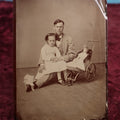Lot 108 - Antique Tintype Photograph Of Father And Daughter With Doll In Pram, Approximately 1/2 Plate, Note Bend On Upper Corner