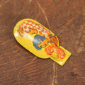 Lot 076 - Antique Tin Lithograph Noisemaker Clicker With Jester / Clown And Lady With Flowers, By Kirchhof, Newark, New Jersey, Made In The U.S.A.