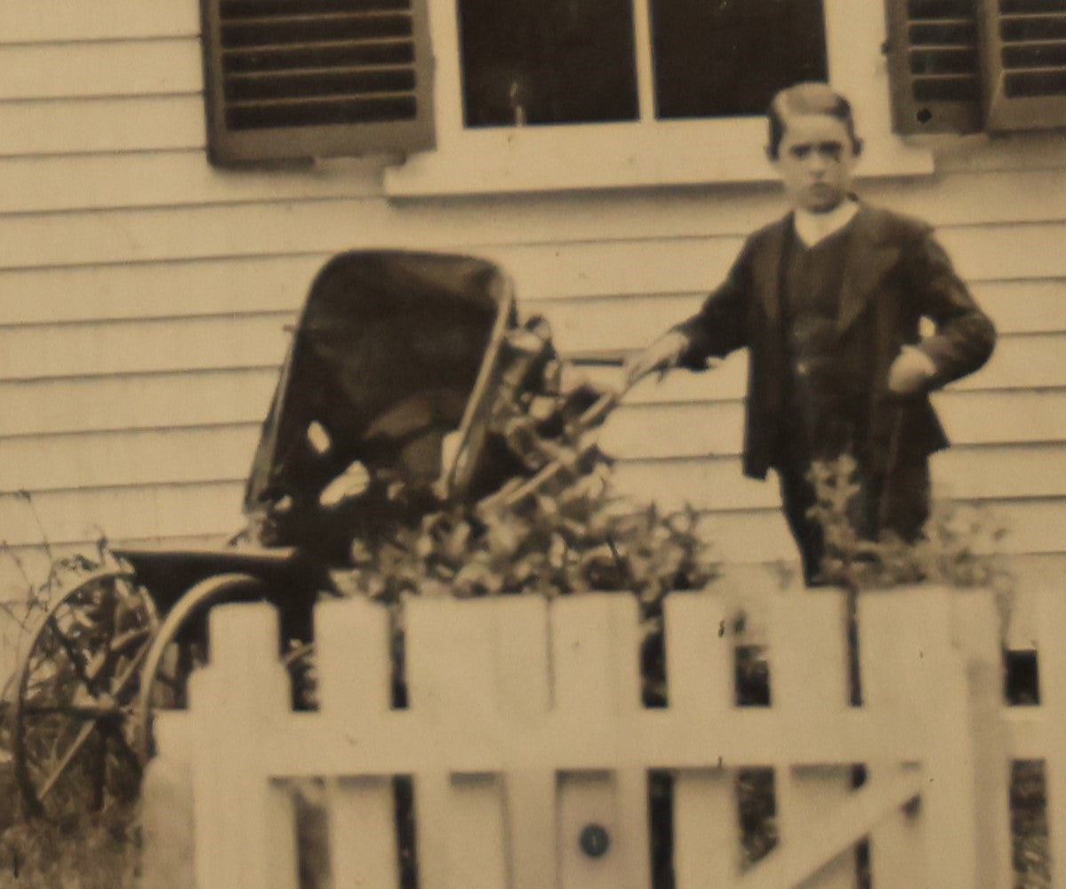 Lot 012 - Large Plate Exterior Tintype Of A Family Outside Of Their Home, Two Adults And Three Children, With White Picket Fence, 6-7/8" X 4-7/8"