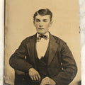 Lot 098 - Single Antique Tintype Photograph, Young Man With A Very Distinctive Face With Defined Bone Structure, Bowtie