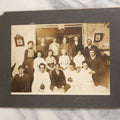 Lot 022 - Antique Turn Of The Century Boarded Photograph Of A Halloween Party, Including Two Women Holding Jack-O-Lantern Pumpkins, Pencil Identification On Back, Approximately 8-7/8" x 7"