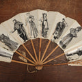 Lot 009 - Antique Varnished Paper Hand Fan With Original Pen And Ink Illustrations Of Many Characters, Actor With Skull, Woman With Dogs, Horse Riders, And More, Two Artist Signatures, Dated 1900
