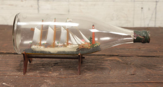 Lot 005 - Vintage Folk Art Ship In A Bottle, Handcrafted With Backdrop, Lighthouse, Ship Marked Boston, Bottle Signed New York, 1930
