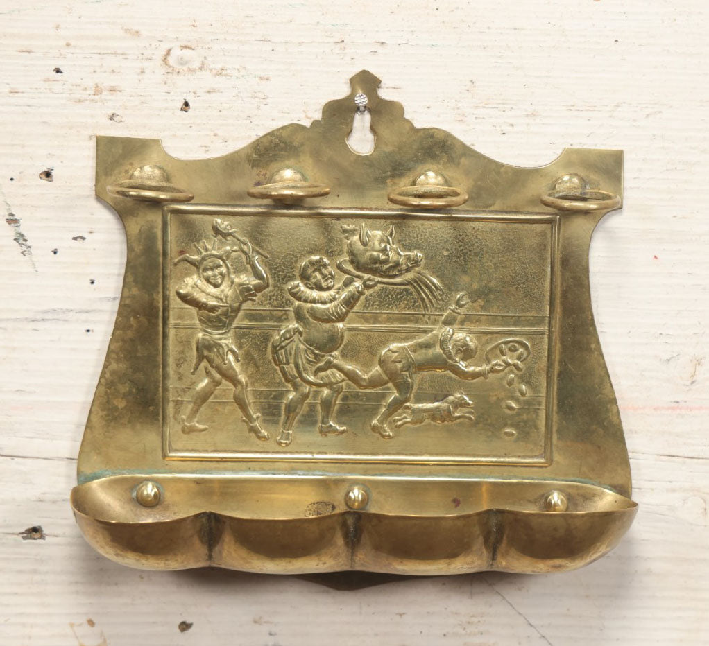 Lot 038 - Antique Pressed Brass Tobacco Pipe Rack With Court Jester, Pig'S Head On Platter, Dog, Etc, Comic Scene, Wall Mountable, Space For 4 Pipes