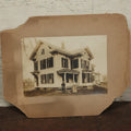 Lot 134 - Antique Boarded Photo Of A Man, Woman, And Their Little Dog Outside Their House, Note Losses To Board