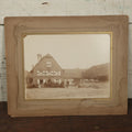 Lot 135 - Antique Boarded Photo Of A Large Group Of Photo Outside Of A Building With A Trade Sign Hanging From It, Horse Drawn Carriage In The Background, Men, Women, And Children, Unknown Location