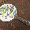 Lot 028 - Antique Silverplate Handle Hand Held Dresser Mirror With Hand Painted Porcelain Backing, Note Mirror Worn, Not Usable, Needs Replaced